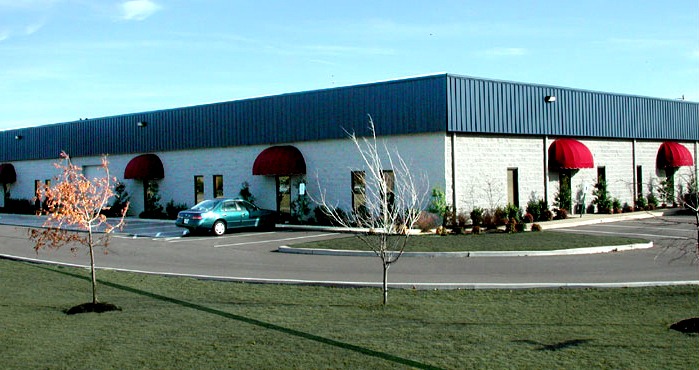 A Building With A Car Outside
